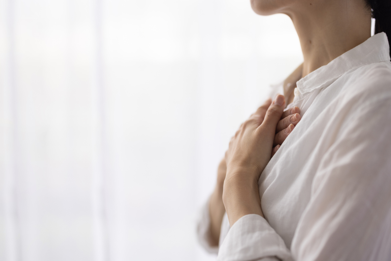 Close-Up of Woman’s Hands on Chest in a Calm, Mindful Moment